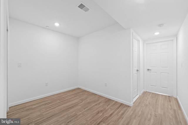 empty room with light hardwood / wood-style floors