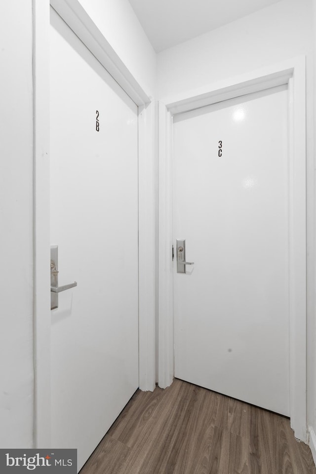 doorway with hardwood / wood-style floors