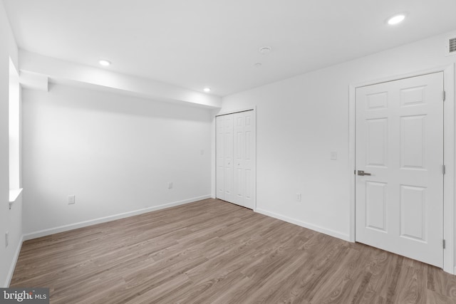 unfurnished room featuring light hardwood / wood-style flooring