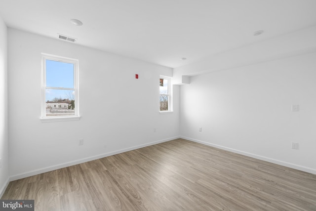 unfurnished room featuring light wood-type flooring