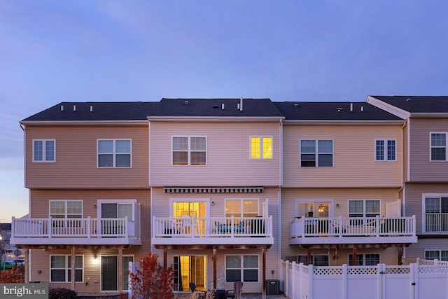 20868 Brunswick Ln, Millsboro, DE 19966 - back house at dusk featuring central AC
