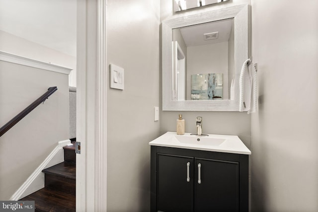 bathroom featuring hardwood / wood-style flooring and vanity