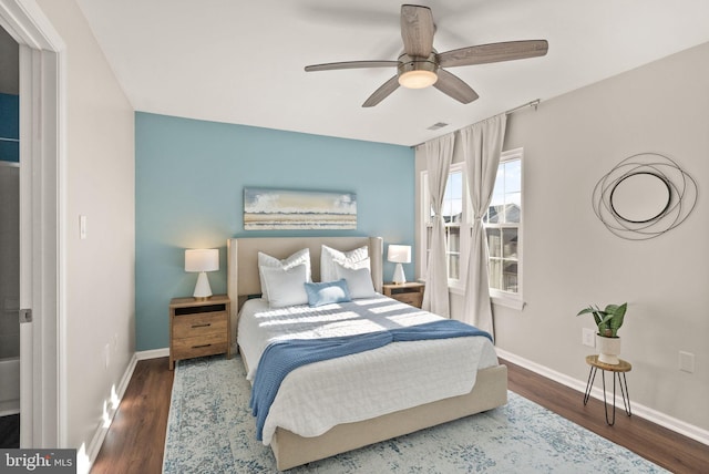 bedroom with ceiling fan and dark hardwood / wood-style flooring