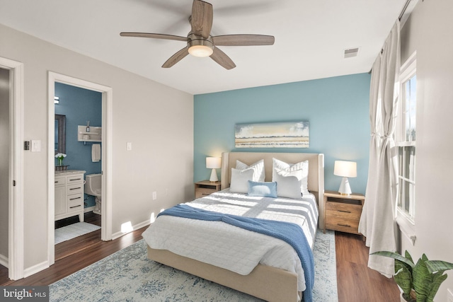 bedroom featuring ensuite bathroom, ceiling fan, and dark hardwood / wood-style flooring