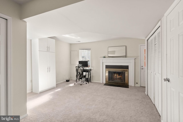 unfurnished living room with light carpet