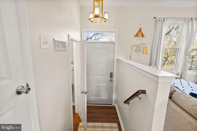 interior space with an inviting chandelier and hardwood / wood-style floors