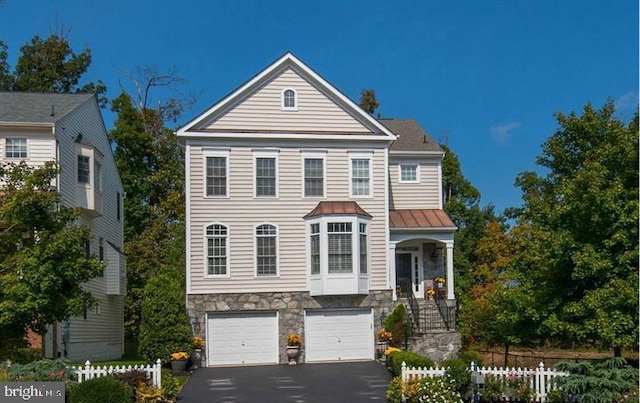 view of front of property with a garage