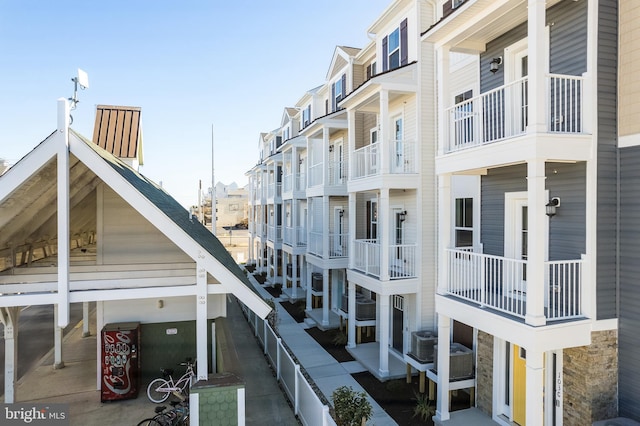 view of building exterior with central AC unit