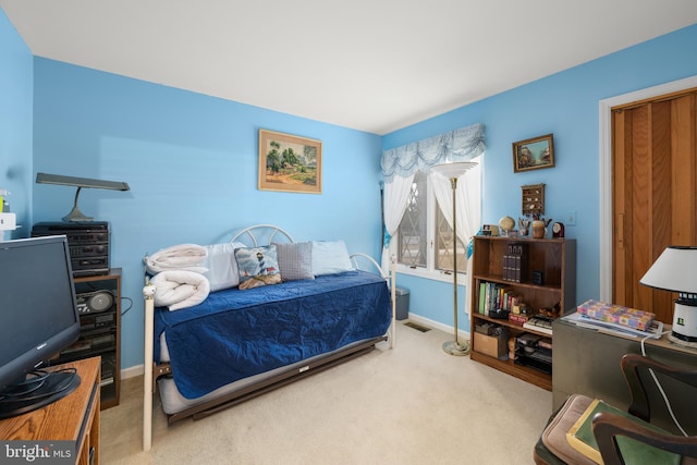 bedroom featuring carpet, visible vents, and baseboards