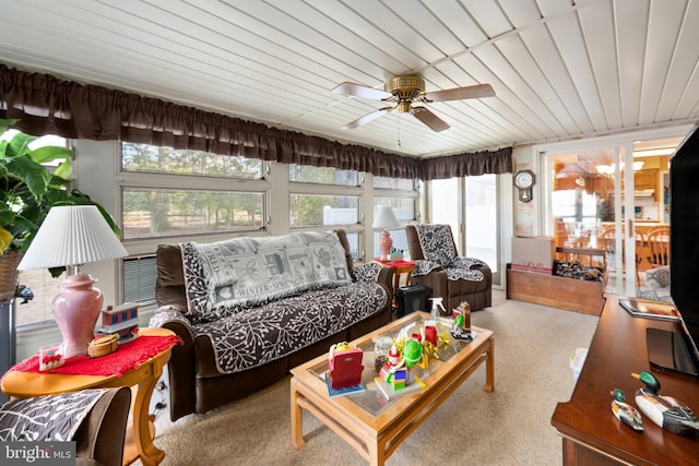 sunroom / solarium featuring wood ceiling and ceiling fan