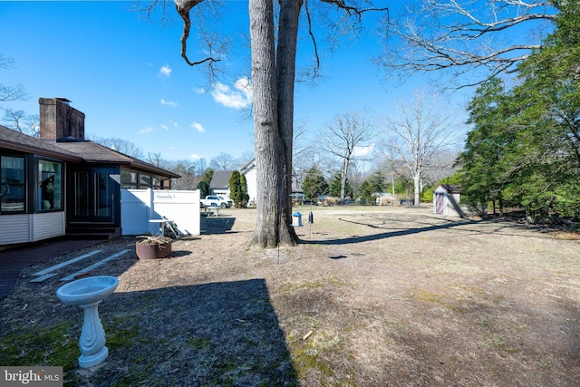 view of yard with a sunroom