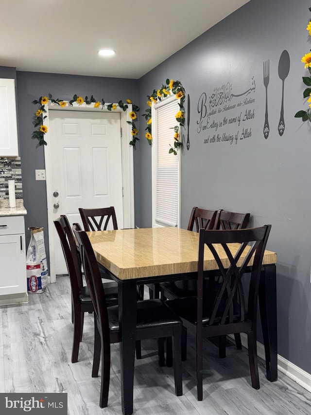 dining space featuring light hardwood / wood-style floors