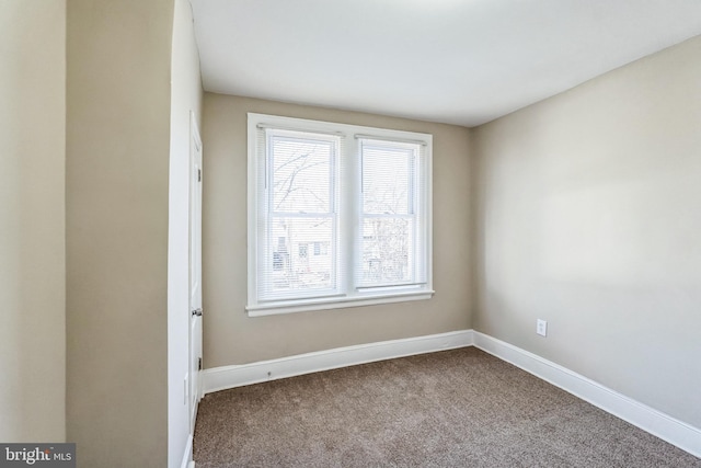 empty room with carpet flooring