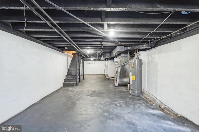 basement featuring heating unit and gas water heater