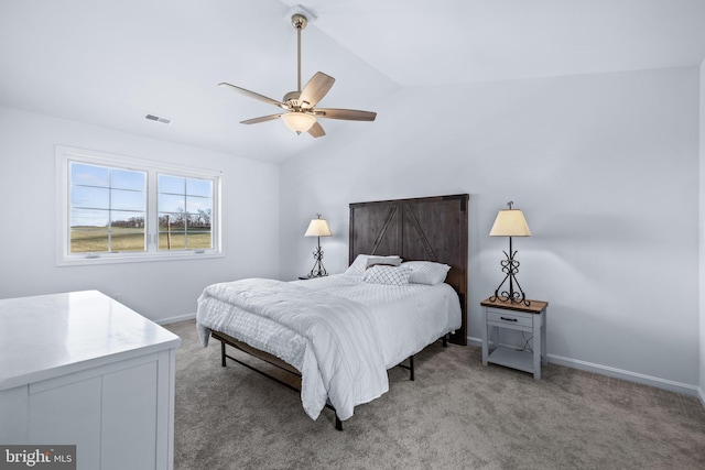 carpeted bedroom featuring lofted ceiling and ceiling fan