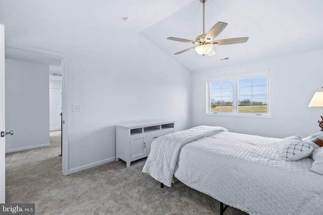 carpeted bedroom with ceiling fan and lofted ceiling