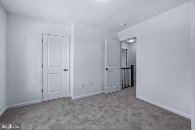 unfurnished bedroom with light carpet