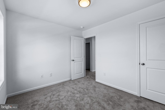 unfurnished bedroom featuring carpet flooring