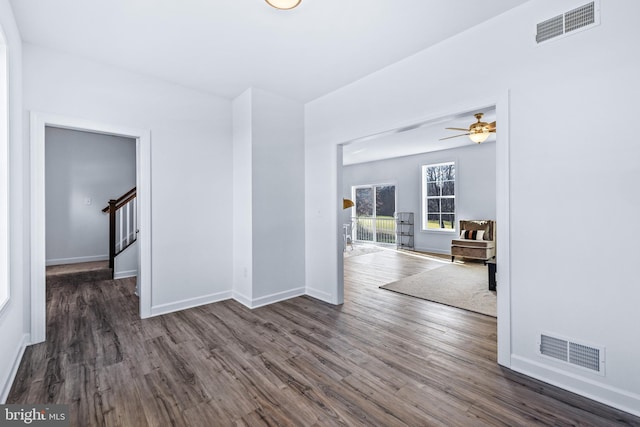 spare room with ceiling fan and dark hardwood / wood-style flooring