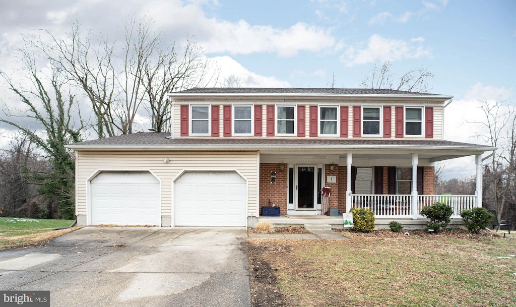 view of front of house with a garage and covered porch