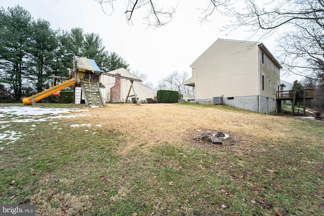 view of yard with central AC and a playground