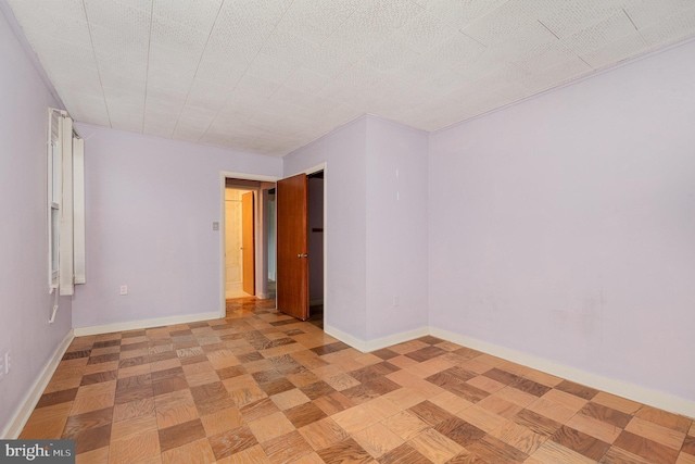 spare room featuring a textured ceiling