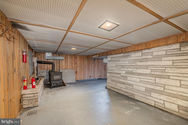 basement featuring a wood stove