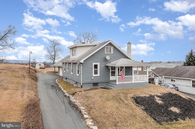 view of front of property with a front lawn and a porch