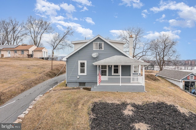 view of front of property with a front lawn and a porch