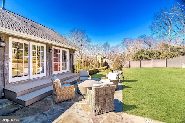 view of patio / terrace with fence and an outdoor living space