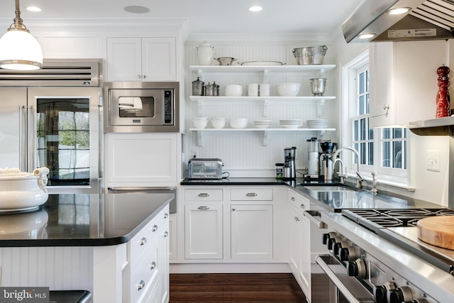 kitchen with stainless steel appliances, under cabinet range hood, white cabinetry, open shelves, and a sink