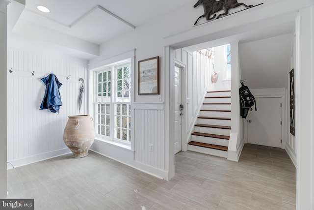 interior space featuring stairs and baseboards