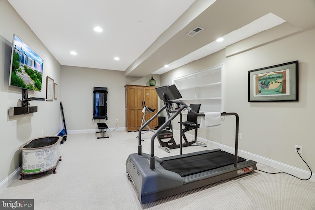 exercise room featuring light carpet, baseboards, visible vents, and recessed lighting