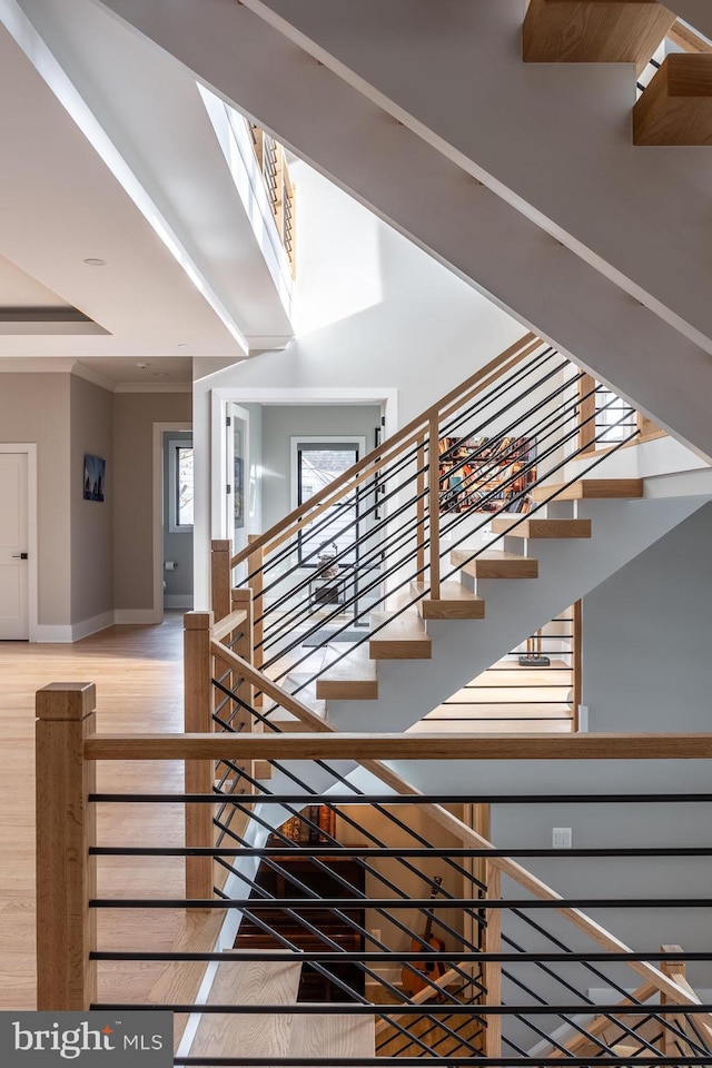 stairs featuring wood-type flooring