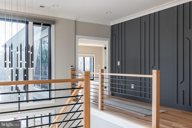 interior space with crown molding and wood-type flooring