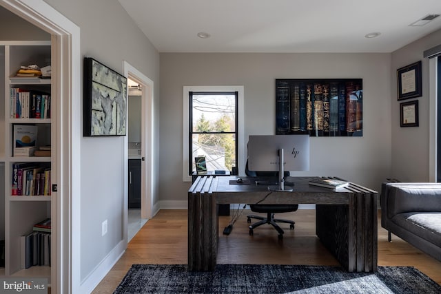 office space featuring hardwood / wood-style floors