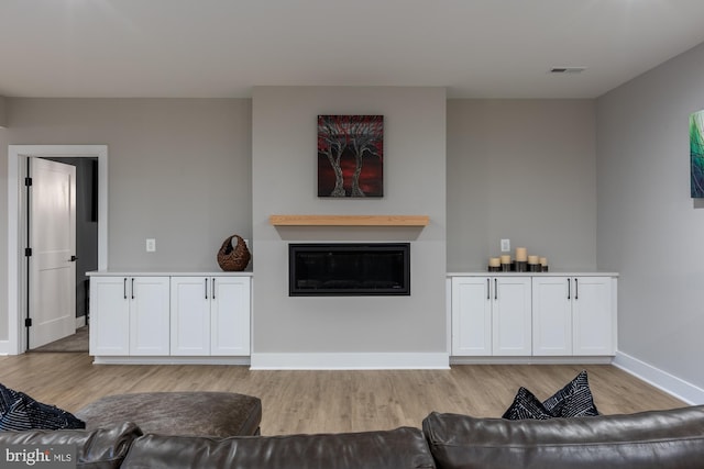 living room with light hardwood / wood-style floors