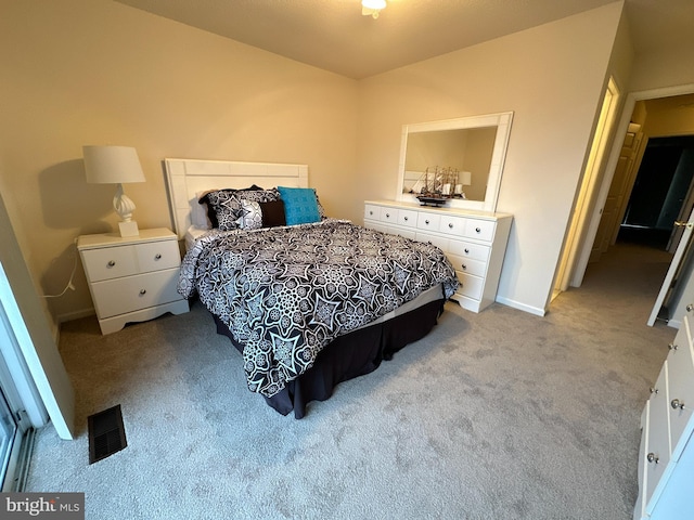 bedroom with light colored carpet