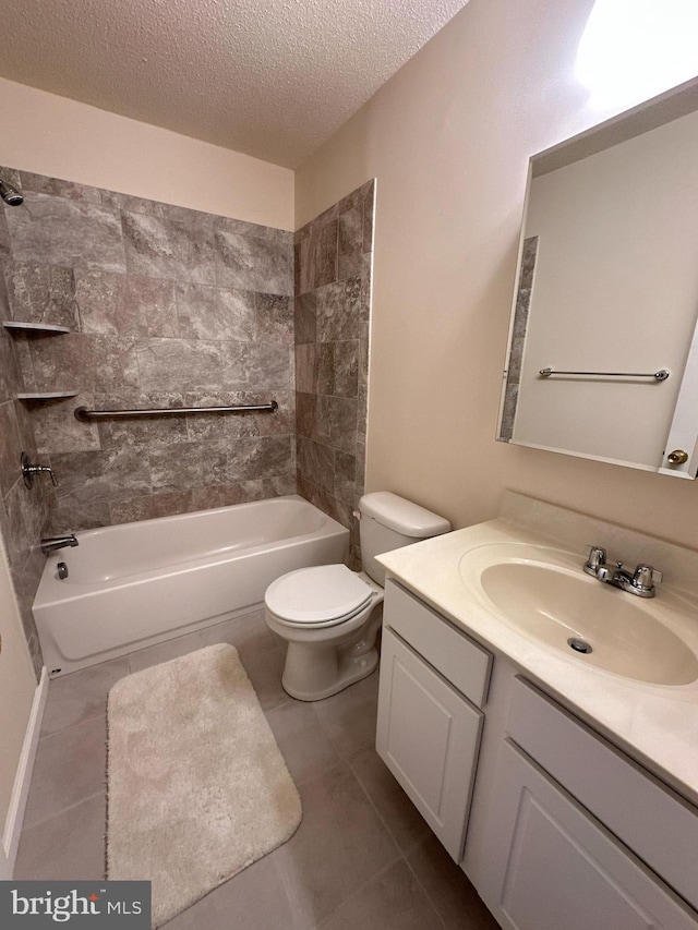 full bathroom with tile patterned flooring, vanity, tiled shower / bath combo, toilet, and a textured ceiling