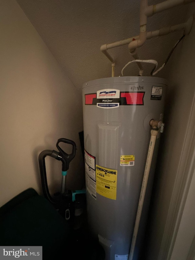 utility room featuring electric water heater