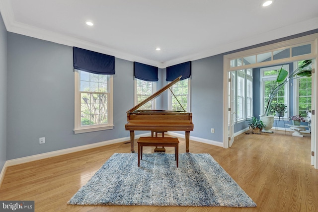 sitting room featuring baseboards, recessed lighting, light wood finished floors, and crown molding