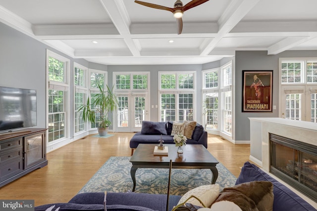 sunroom / solarium with beam ceiling, french doors, coffered ceiling, wood finished floors, and recessed lighting