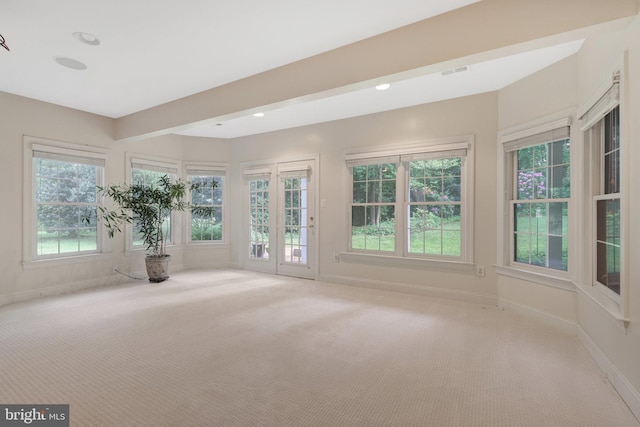 unfurnished sunroom featuring french doors