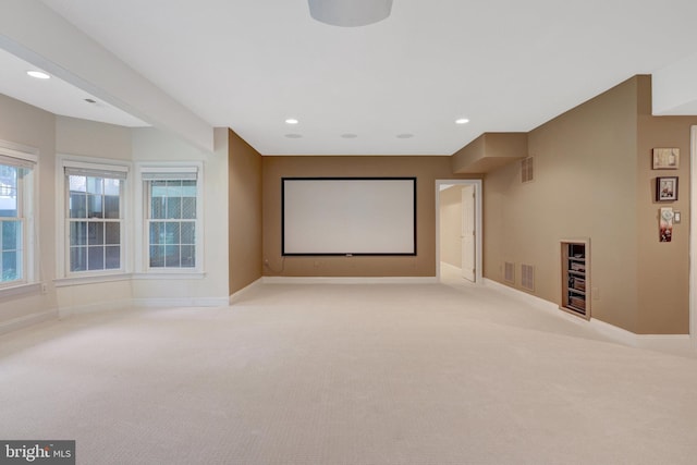 carpeted cinema room with baseboards and recessed lighting