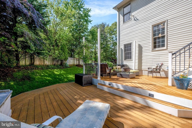 wooden deck with an outdoor living space