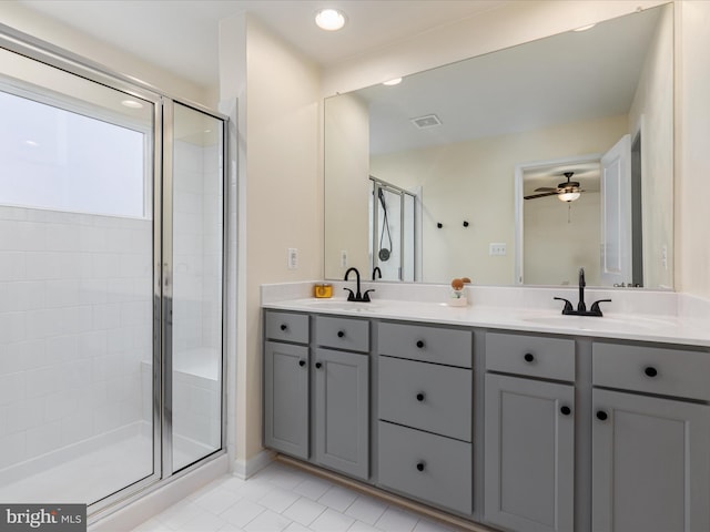 bathroom featuring vanity, tile patterned floors, a shower with door, and ceiling fan