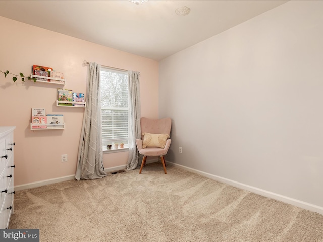 living area with carpet floors