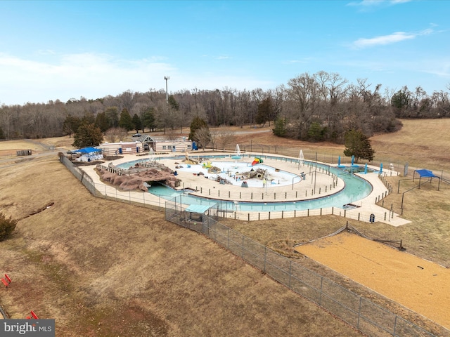 view of pool featuring a yard