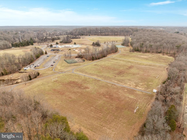 birds eye view of property with a rural view