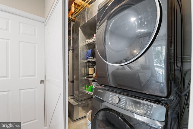 laundry room featuring laundry area and stacked washer and clothes dryer